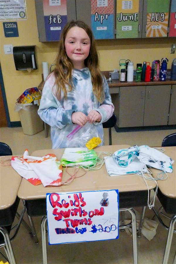 girl selling towels